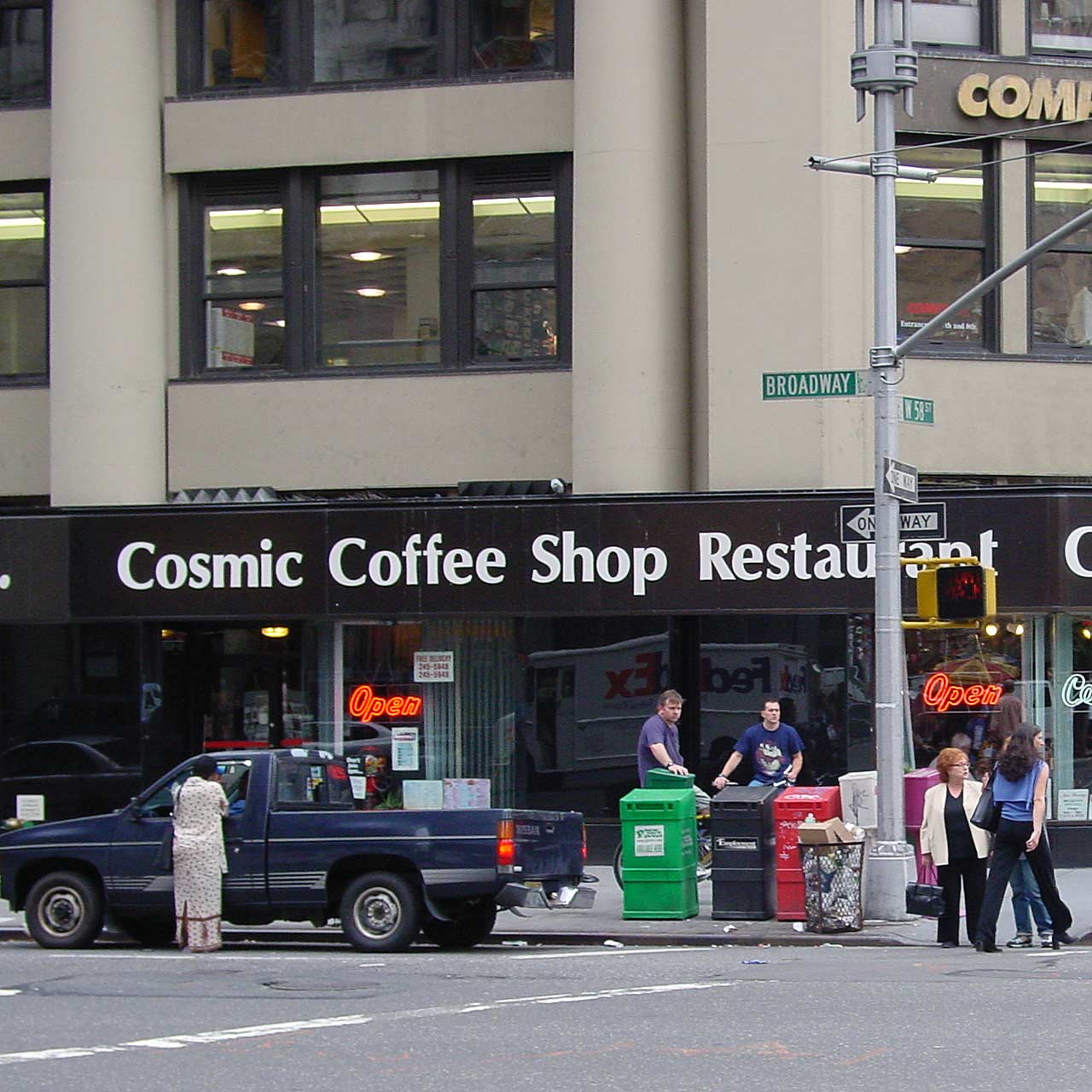 The Cosmic Coffee Shop storefront, with a prominant sign that faces 58th Street and Broadway.