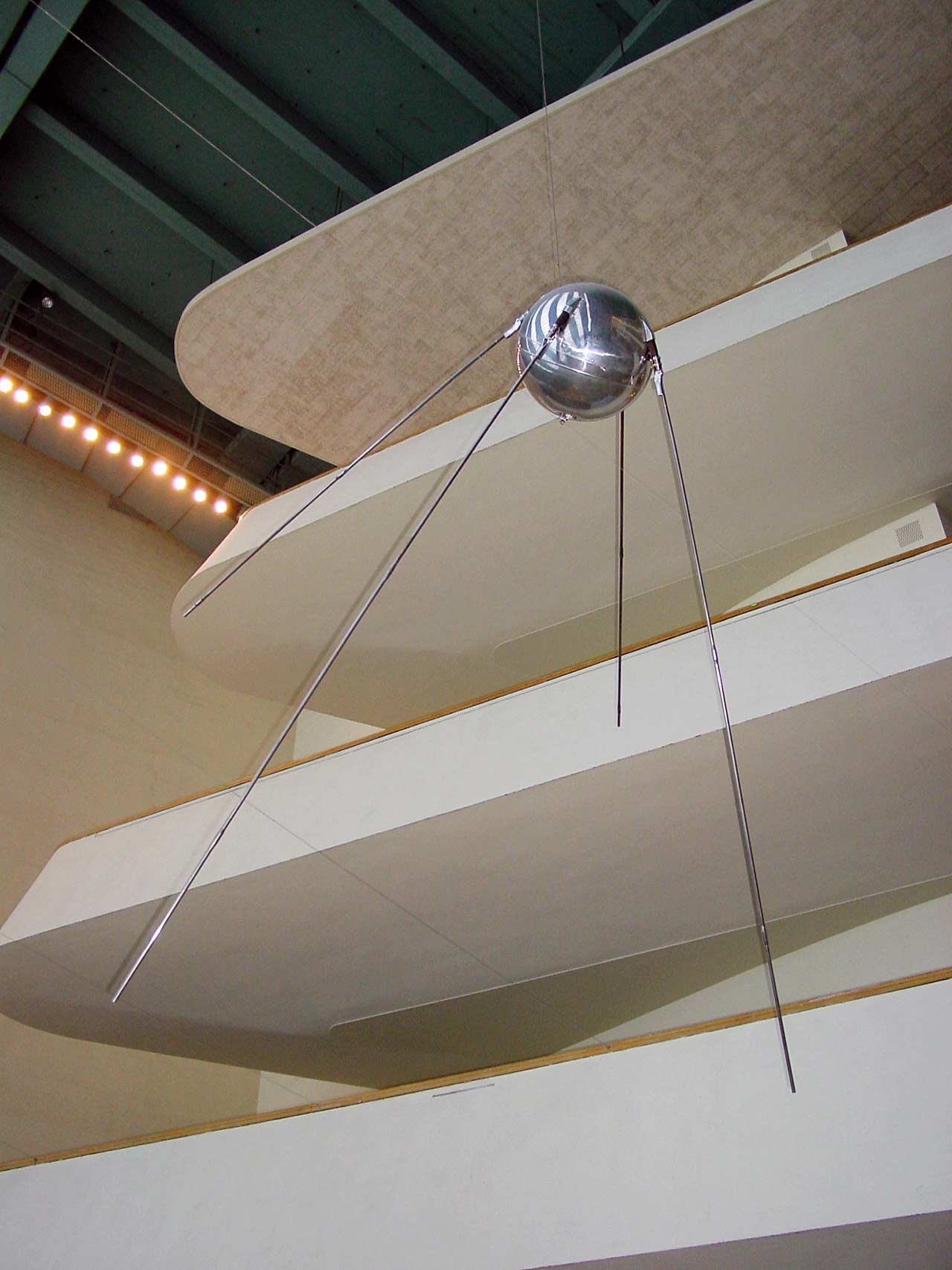 A model of Sputnik 1 hanging from the ceiling of the interior of the UN.