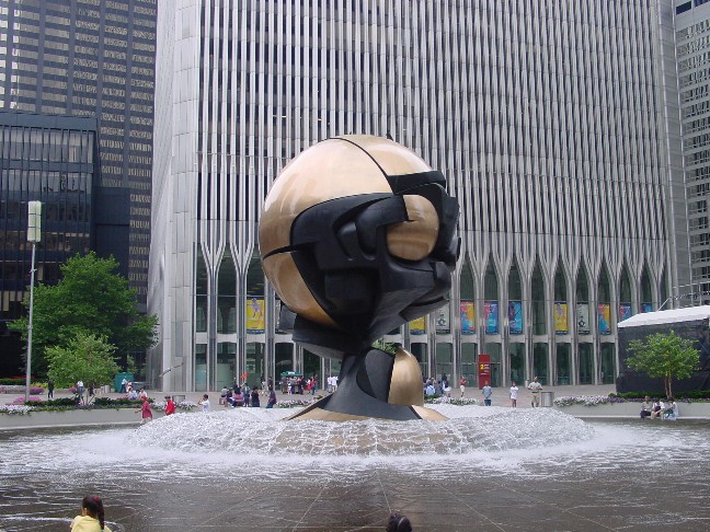The “Sphere” sculpture and fountain with the base of the World Trade Center in the background.