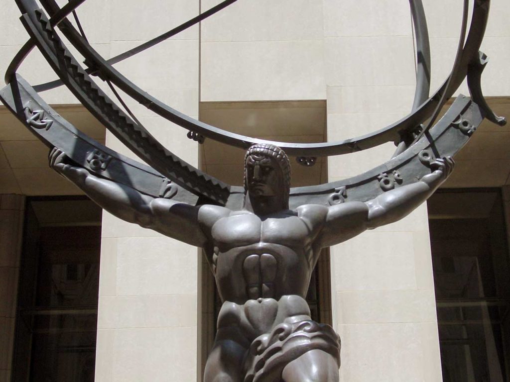 Close up of Atlas, showing his head and torso, with the armillary rings on his shoulder with astronomical symbols.